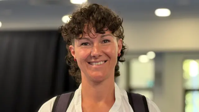 Tina Bury - a woman with short curly hair - smiling