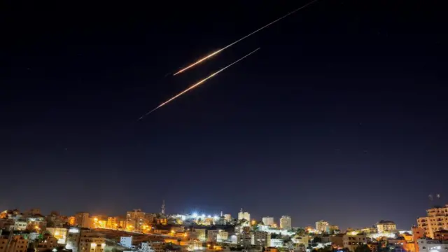 Missiles launched from Iran towards Israel are seen from Hebron