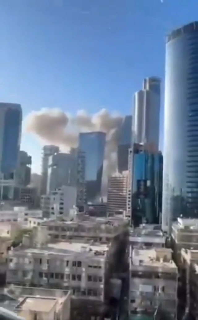 A still from a video shows smoke rising from an explosion in the Ramat Gan area of Tel Aviv