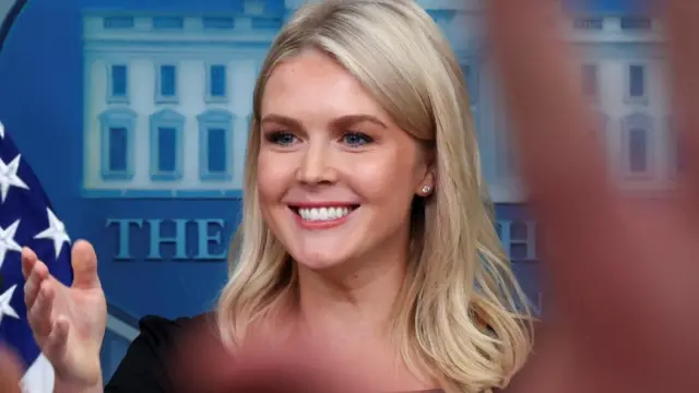White House Press Secretary Karoline Leavitt smiles at a press briefing at the White House