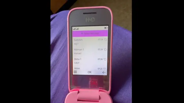 A mobile showing Sepideh texting her family