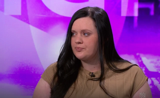 Fiona, with dark hair and a cream top