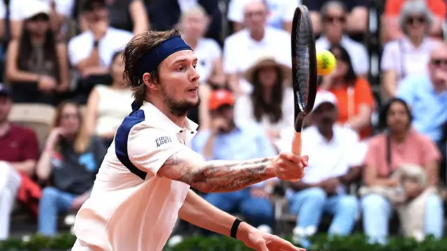 Alexander Bublik plays a forehand return