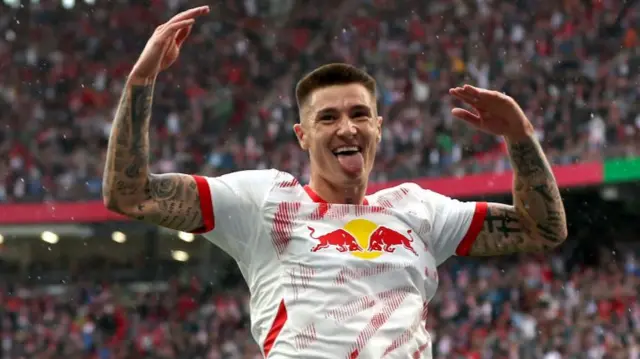 Benjamin Sesko of RB Leipzig celebrates