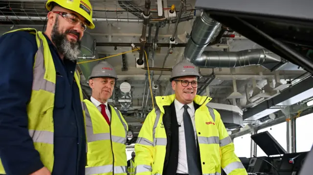 Defence Secretary John Healey (centre) and Prime Minister Sir Keir Starmer (right) during a visit to BAE Systems in Govan, Glasgow, to launch the Strategic Defence Review. Picture date: Monday June 2, 2025