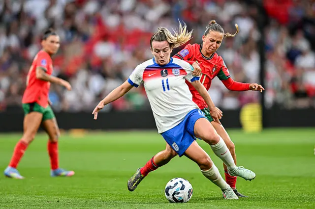 Lauren Hemp running with the ball against Portugal