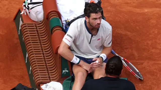 Cameron Norrie receiving medical treatment