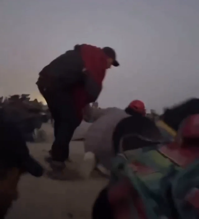 A screengrab taken from a video posted to Instagram - which we have verified - shows people ducking for cover on a beach