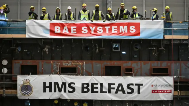 Description Members of staff watch Prime Minister Sir Keir Starmer during a visit to BAE Systems in Govan, Glasgow, to launch the Strategic Defence Review.
