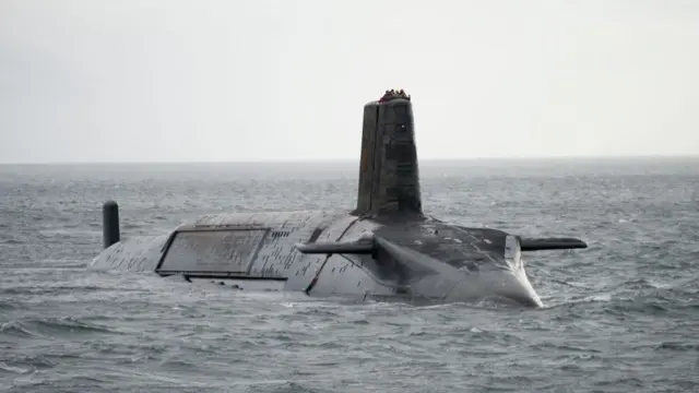 A file photo of a UK Vanguard submarine, partially submerged in water