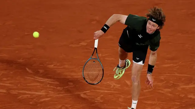 Andrey Rublev serves