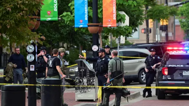 Police and FBI agents gather after an attack that injured multiple people in Boulder