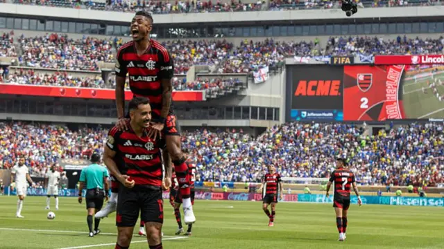 Goalscorers Henrique and Danilo celebrate the second of the game