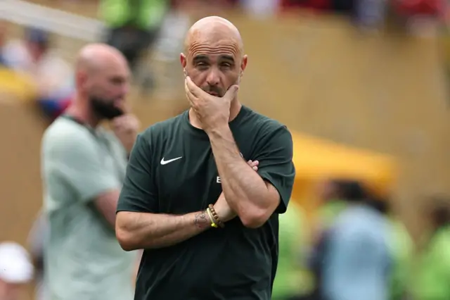 Maresca puts his hand over his face in frustration