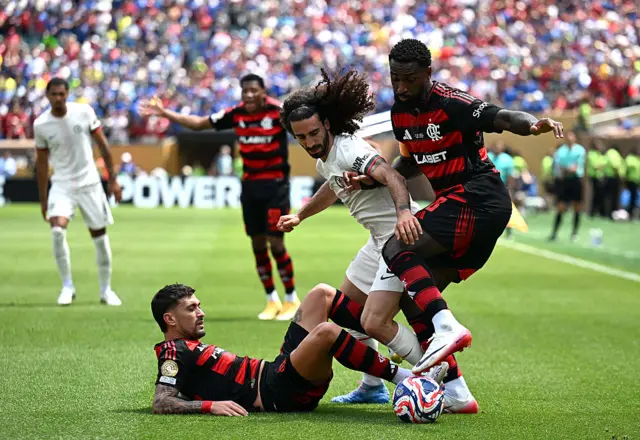 Chelsea and Flamengo players crunch into challenges