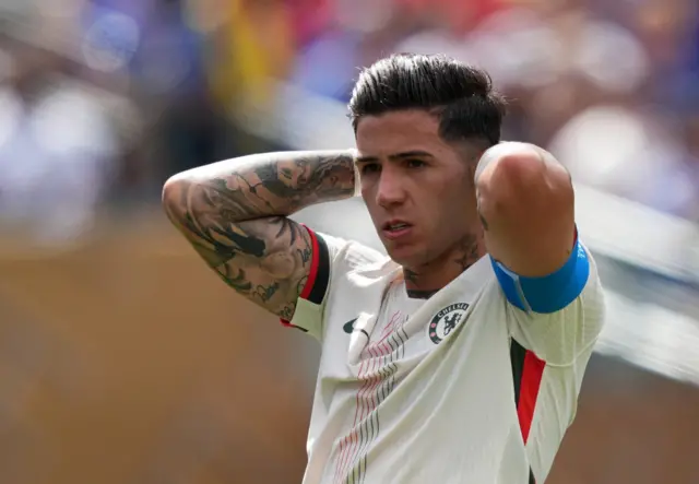 Fernandez puts his hands behind his head