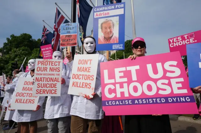 Campaigners for and against the assisted dying Bill demonstrate at Parliament Square