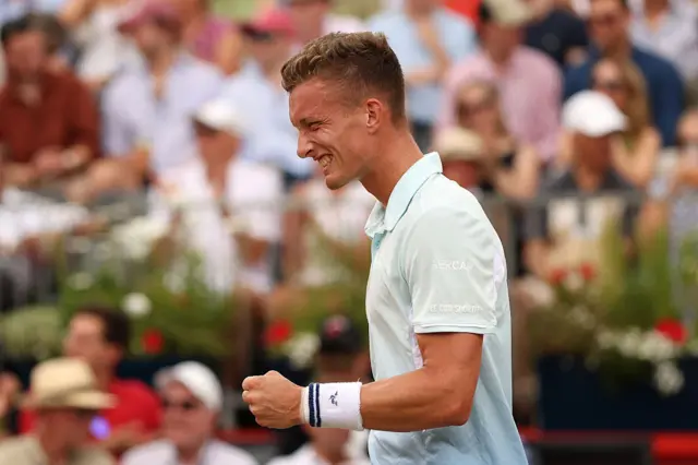 Lehecka celebrates winning break point with a clenched fist