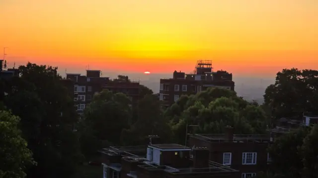 Sunrise over high rise buildings in Highgate, London.