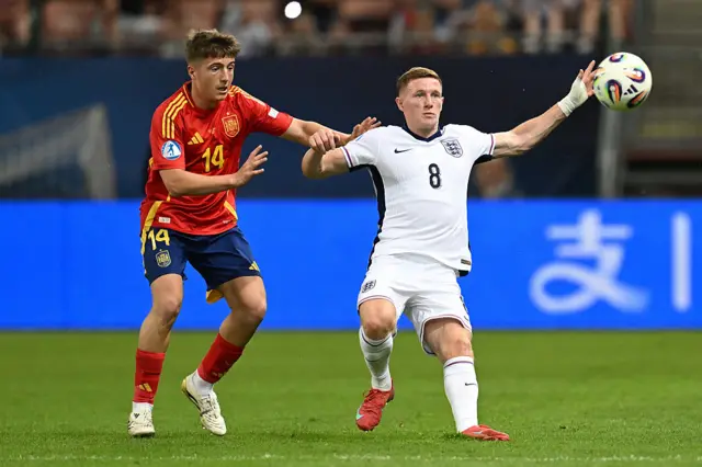 Elliot Anderson of England battles for possession with Mikel Jaureguizar of Spain