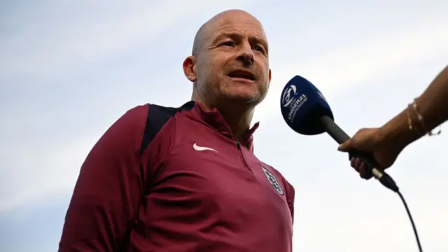 Lee Carsley, Head Coach of England, speaks during a pitch side interview prior to the UEFA European Under-21 Championship 2025