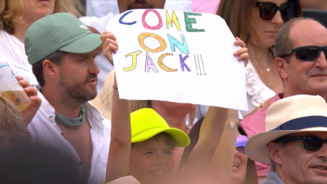 A fan holds a sign that reads 'come on Jack!'
