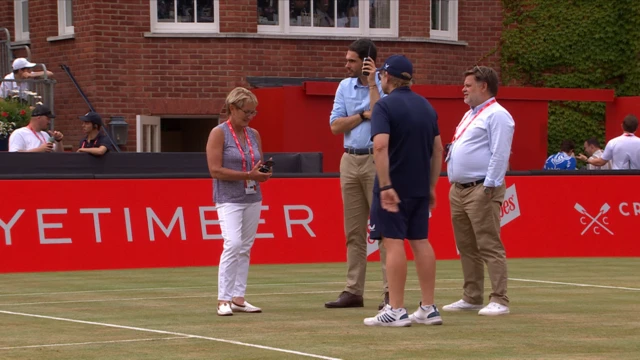 Ground staff stand around waiting for news