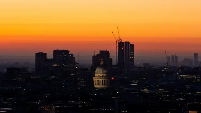 The sun rising over St Paul's Cathedral in London