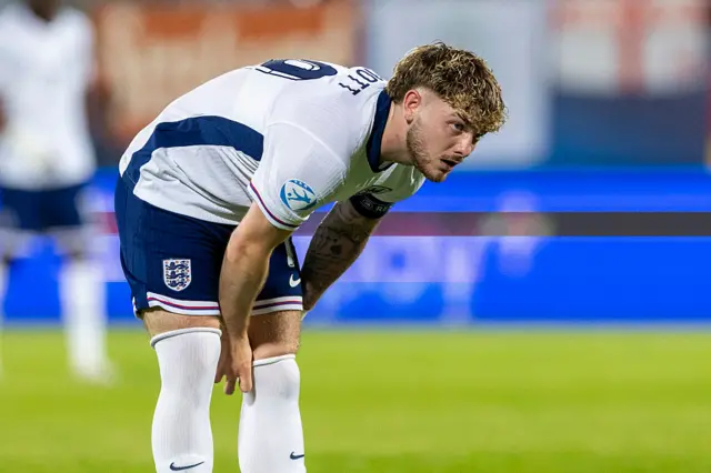 Harvey Elliott pulling his socks up