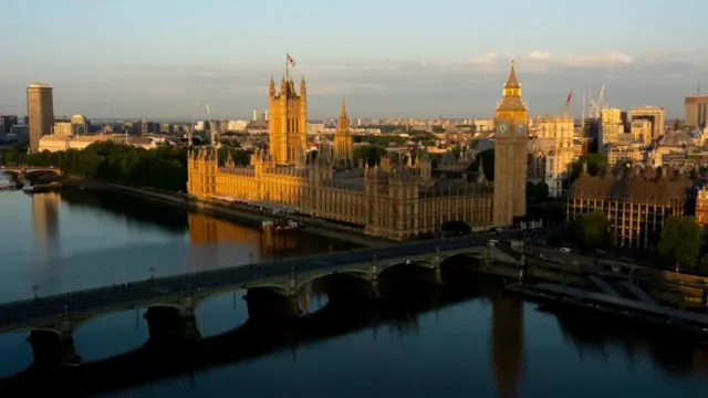 The sun rises over the Houses of Parliament