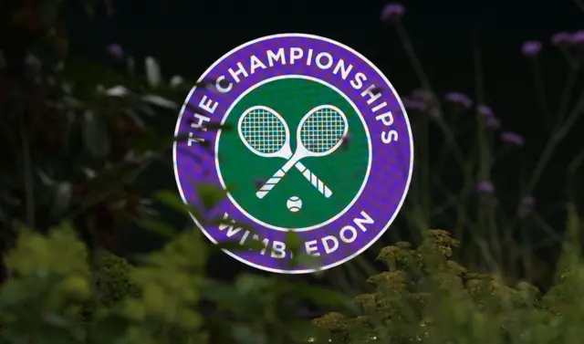 A sign saying 'The Championships Wimbledon' outside Wimbledon