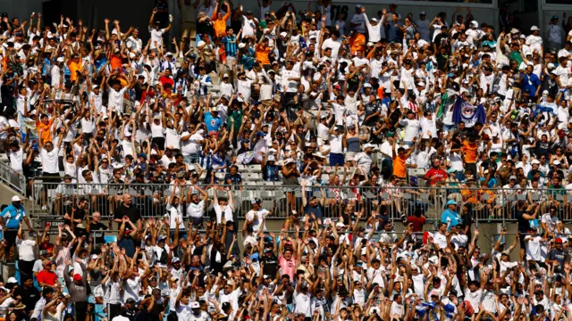 Fans do the Mexican wave during the game between Real Madrid and Pachuca