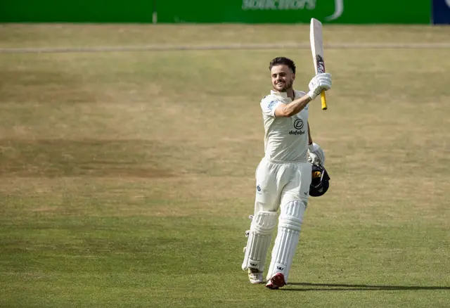 Joe Cracknell of Middlesex celebrates reaching his maiden first-class century