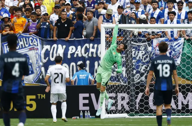 Courtois tips the ball over the bar