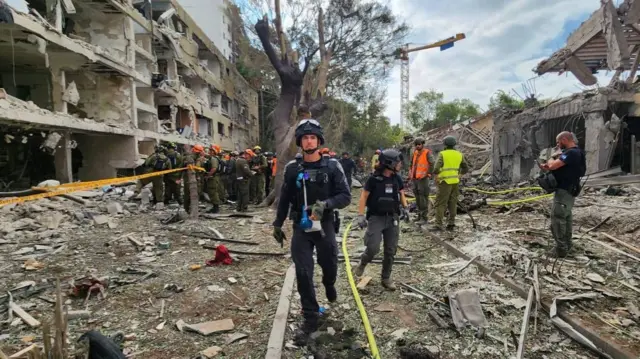 Israeli police treating the scene of a fall in the Tel Aviv area