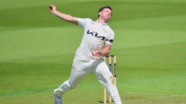 Nathan Smith bowling for Surrey
