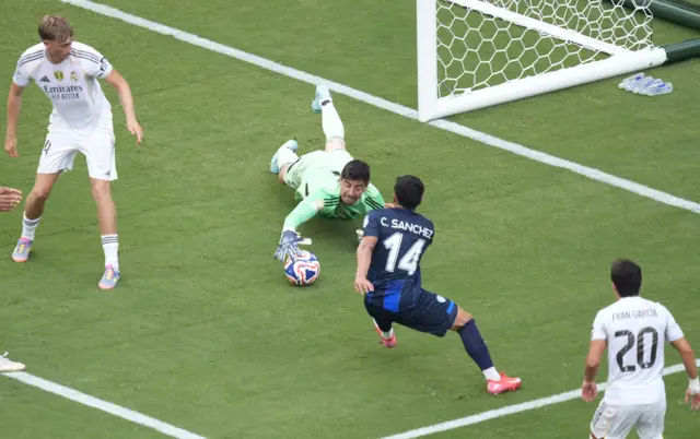 Courtois gets down low to save from Carlos Sanchez