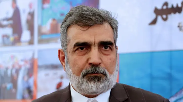 Spokesman Behrouz Kamalvandi looks ahead wearing a blazer.