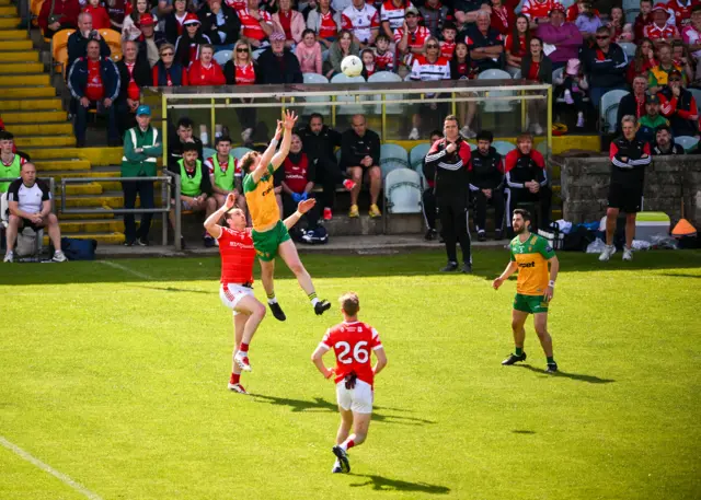 Ciaran Thompson of Donegal in action against Tommy Durnin