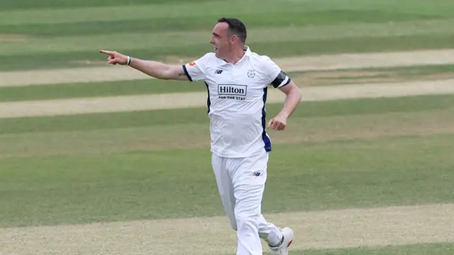 Kyle Abbott celebrates