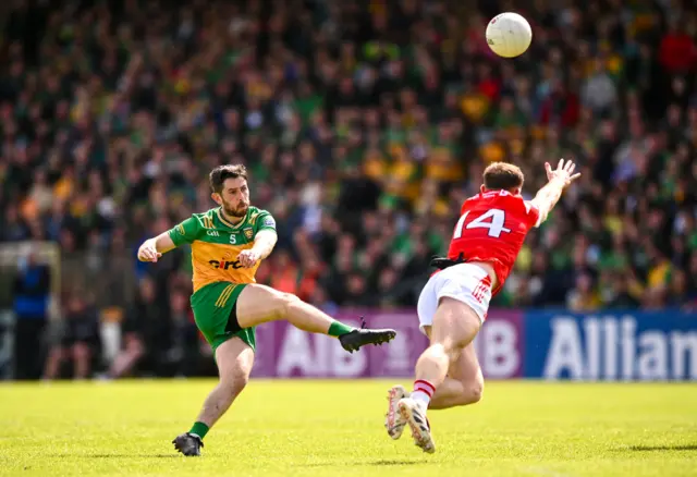 Ryan McHugh of Donegal in action against Sam Mulroy of Louth