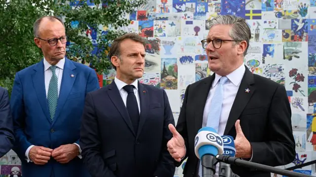 Friedrich Merz, Emmanuel Macron and Sir Keir Starmer speaking to press outdoors during G7 in Canada