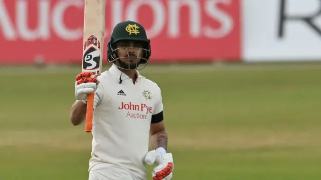 Ishan Kishan of Nottinghamshire celebrates a half century