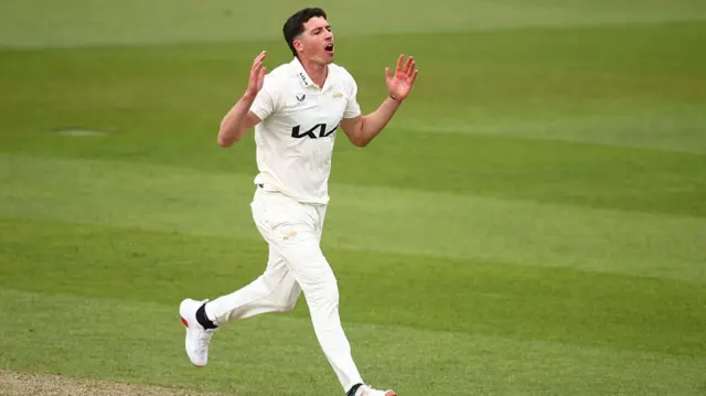 Matthew Fisher bowling for Surrey
