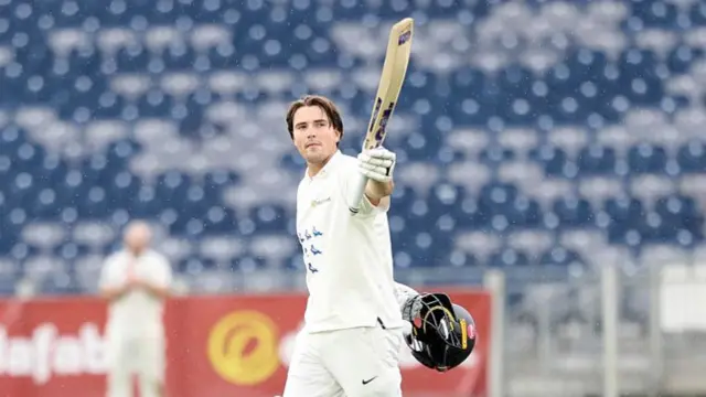James Coles acknowledging the applause for his century against Durham