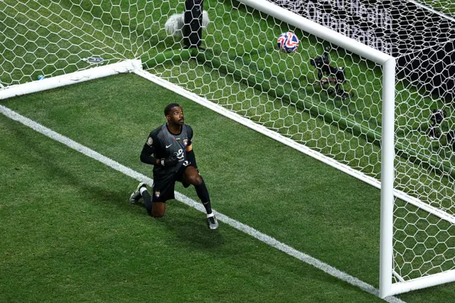 Goalkeeper Khalid Eissa watches
