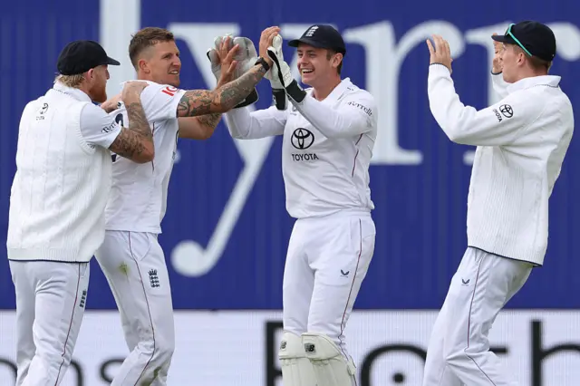 England celebrating after getting a wicket