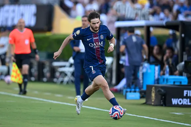 Khvicha Kvaratskhelia running with the ball for PSG