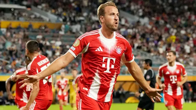 Harry Kane of FC Bayern Munchen celebrates scoring his team's first goal