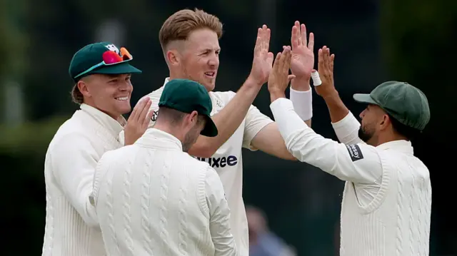 Ben Allison and Worcestershire team mates celebrating taking a wicket